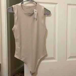 Small tan/nude bodysuit